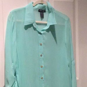 Light blue blouse over top with gold buttons